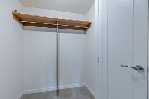 a white door with a metal bar