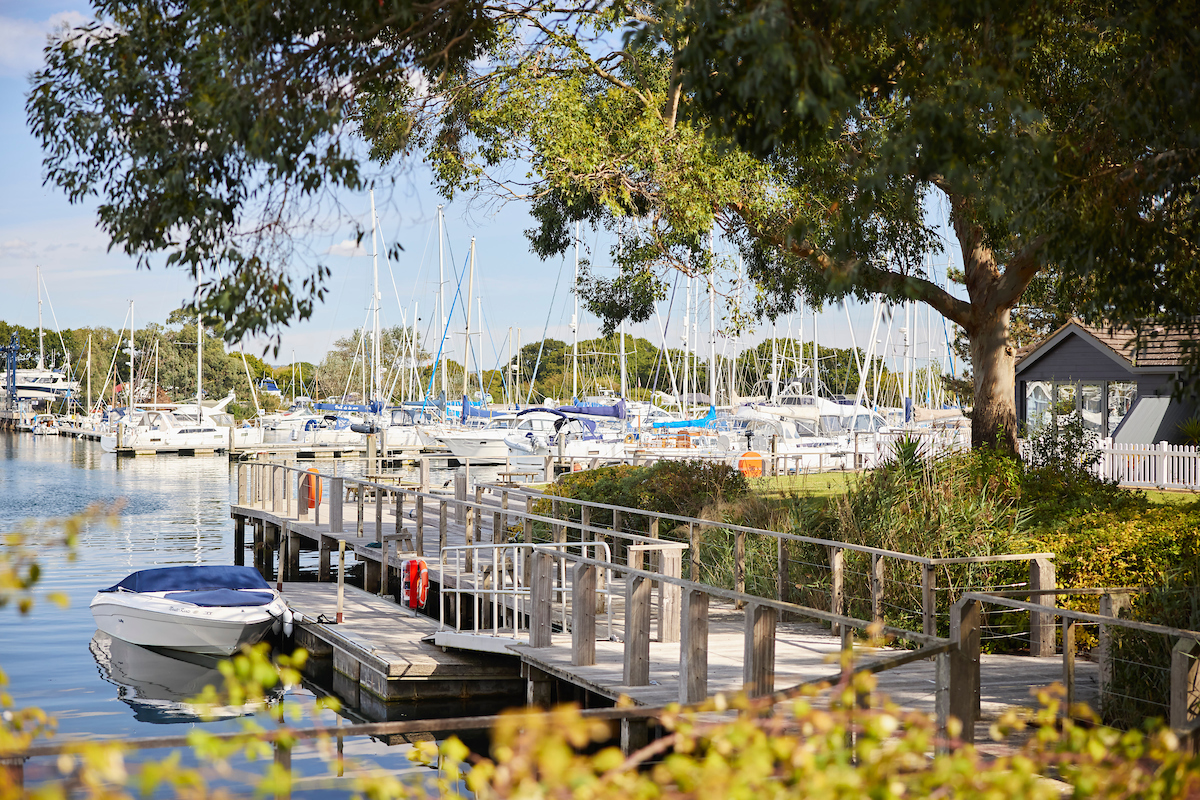 a dock with boats in a harbor