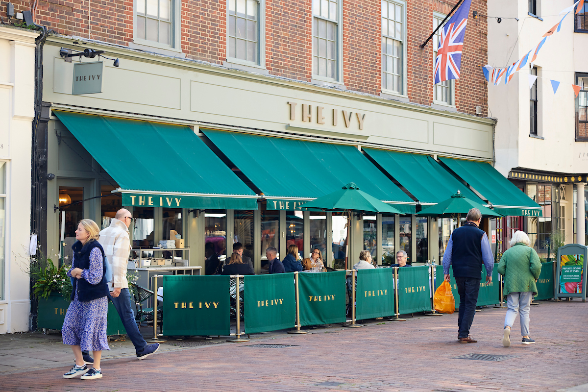 a group of people outside a restaurant