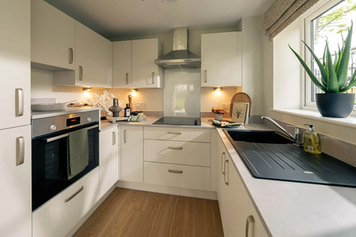 a kitchen with white cabinets