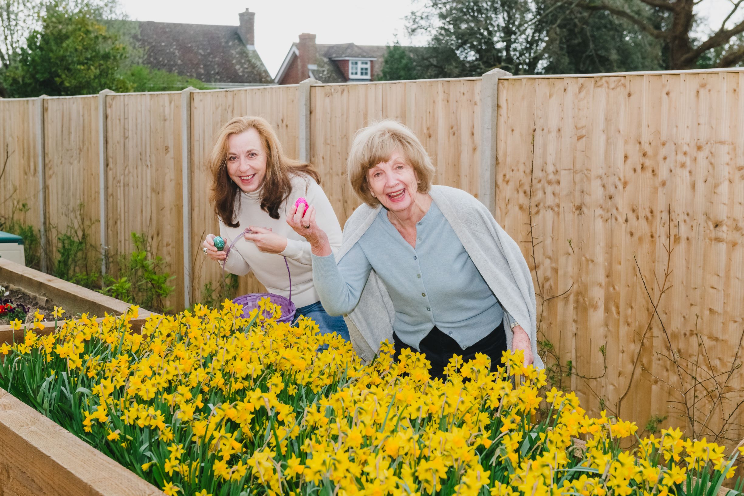 a person and a girl in a garden