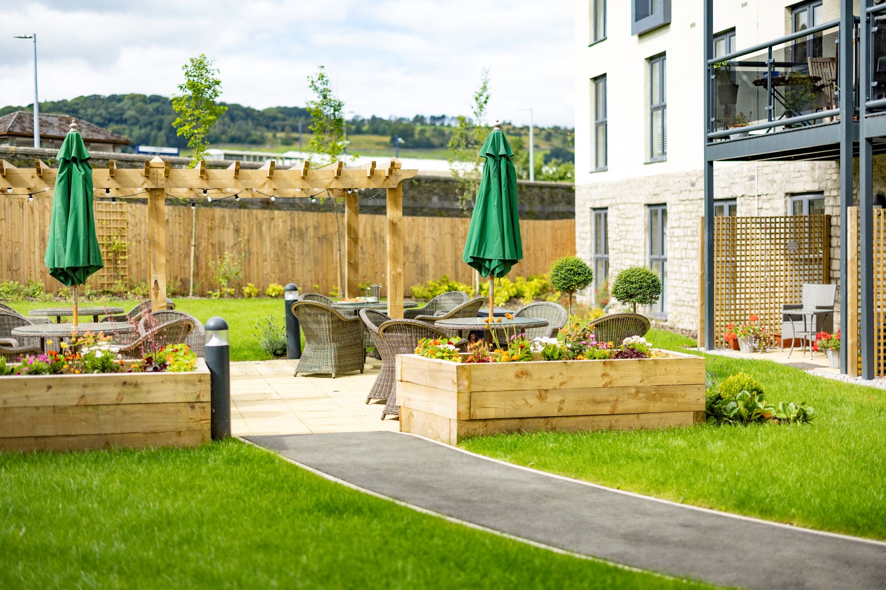 a backyard with a fence and a garden