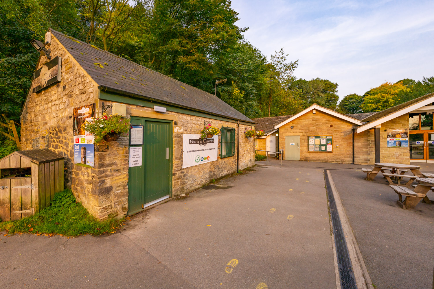a small building with a green door