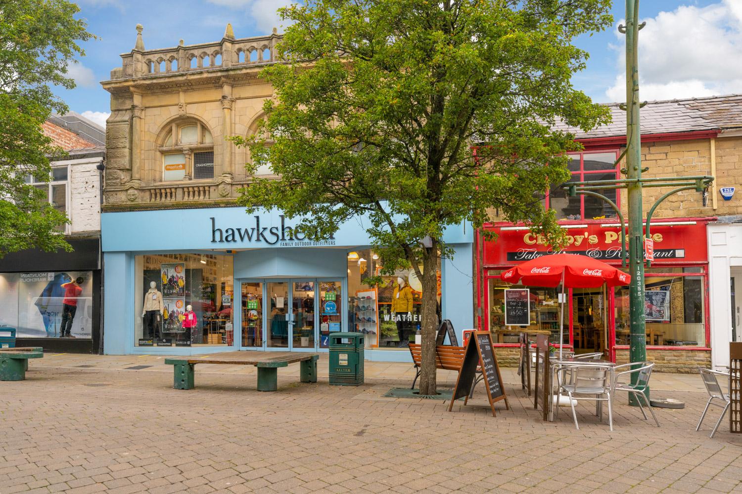 a tree in front of a store