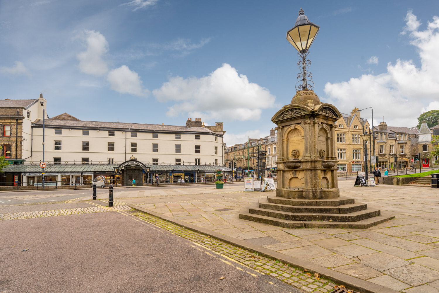 a large stone statue in a city