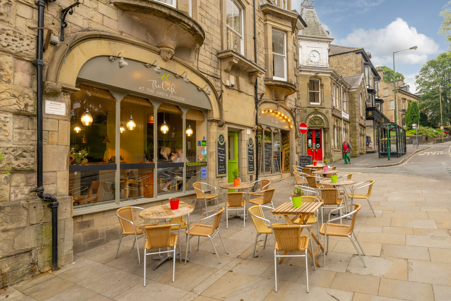 a group of tables and chairs outside a building