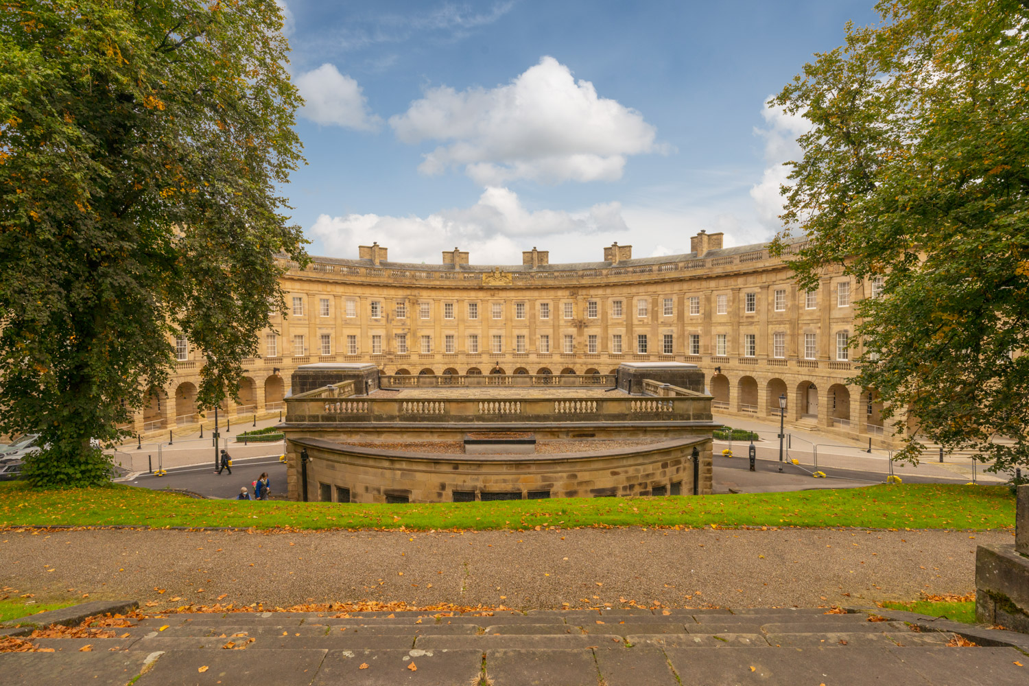 a large building with trees in front of it