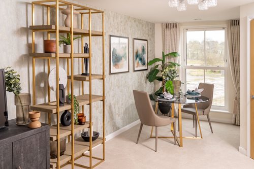 a room with a table and chairs