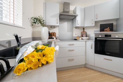 a kitchen with white cabinets