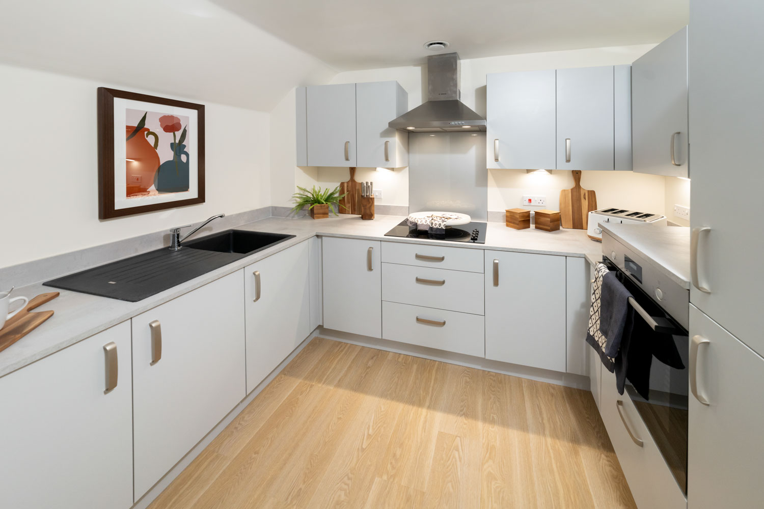 a kitchen with white cabinets