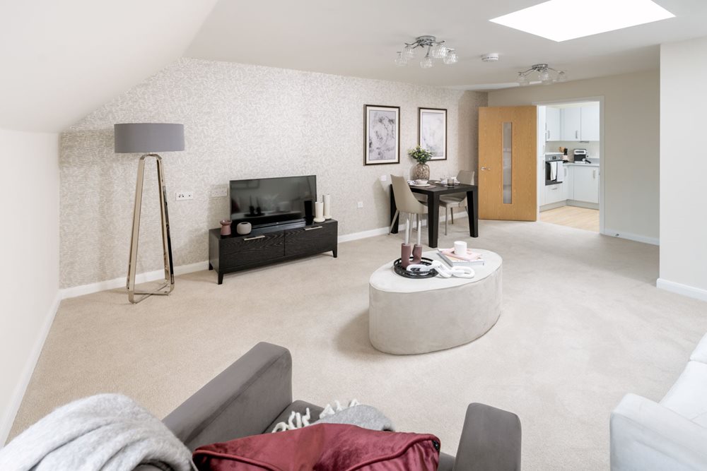 a living room with a tv and couches