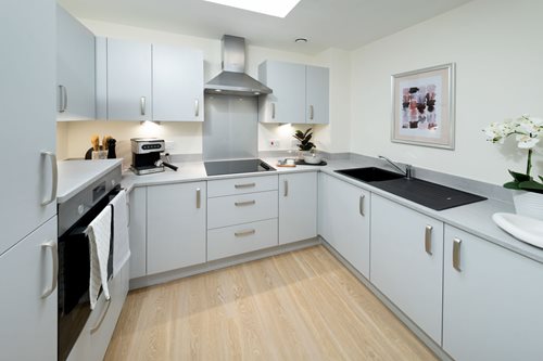 a kitchen with white cabinets