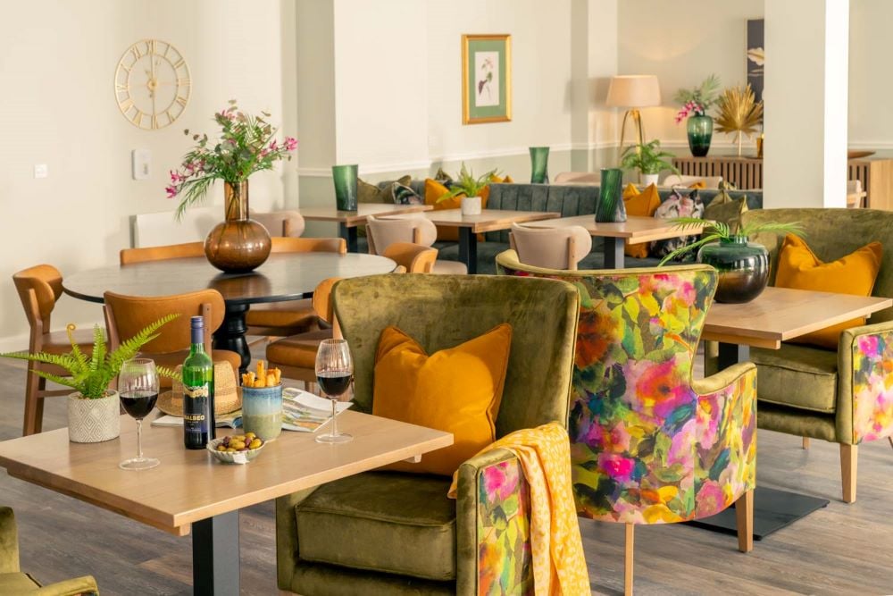 a room with a table chairs and a couch