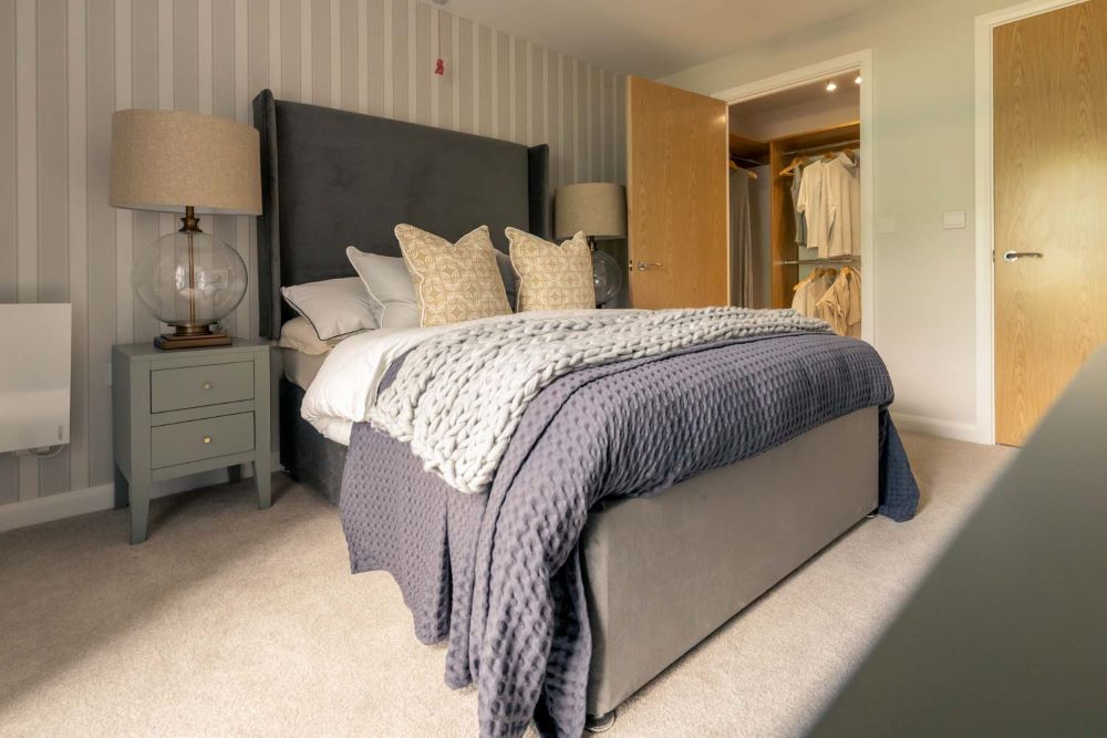 a bed with a blue blanket