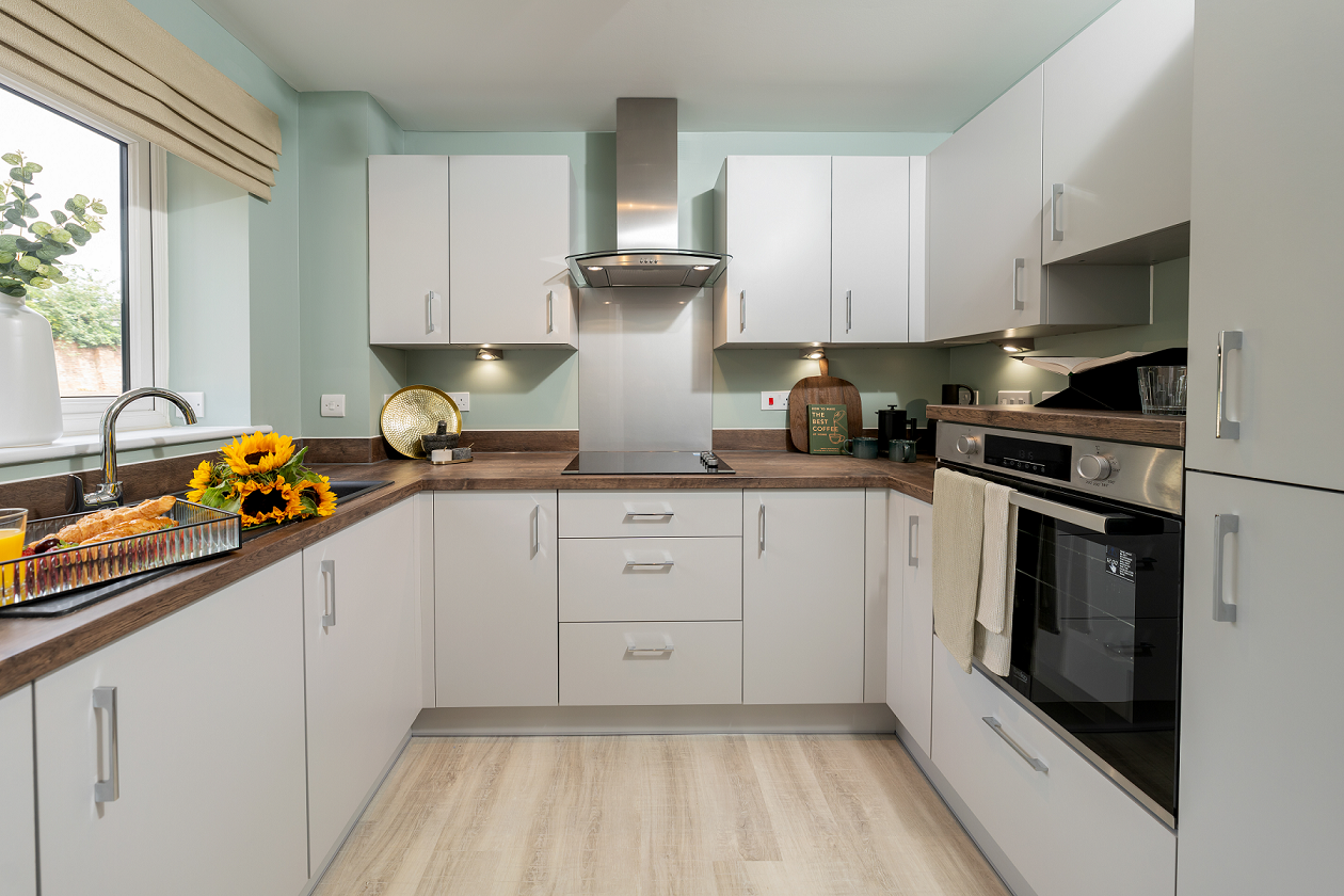 a kitchen with white cabinets