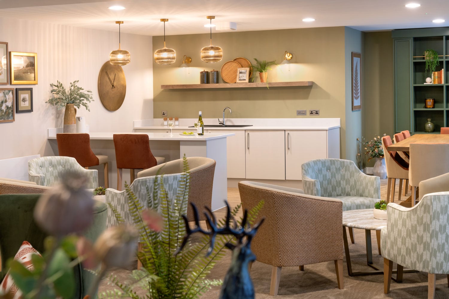 a kitchen with chairs and tables