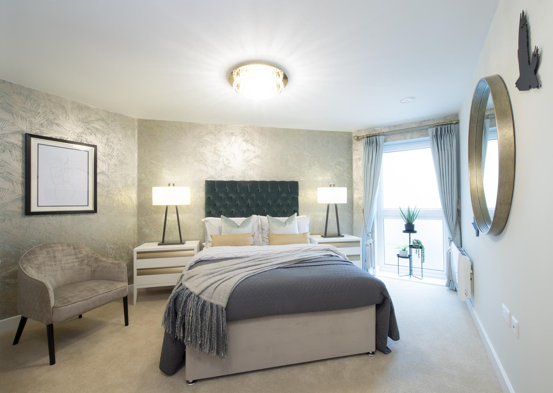 a bedroom with a bed and a chair