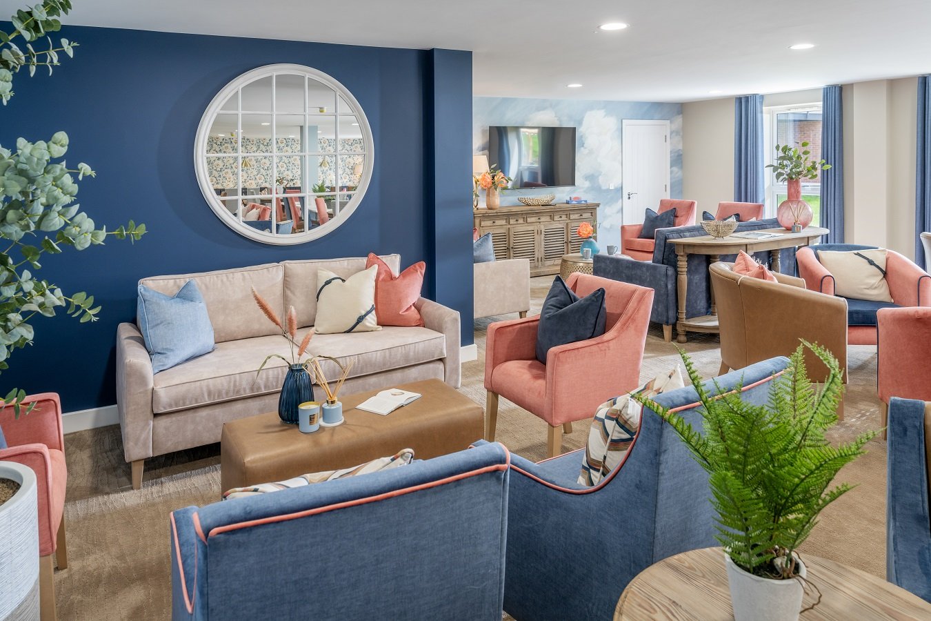 a living room with a blue wall