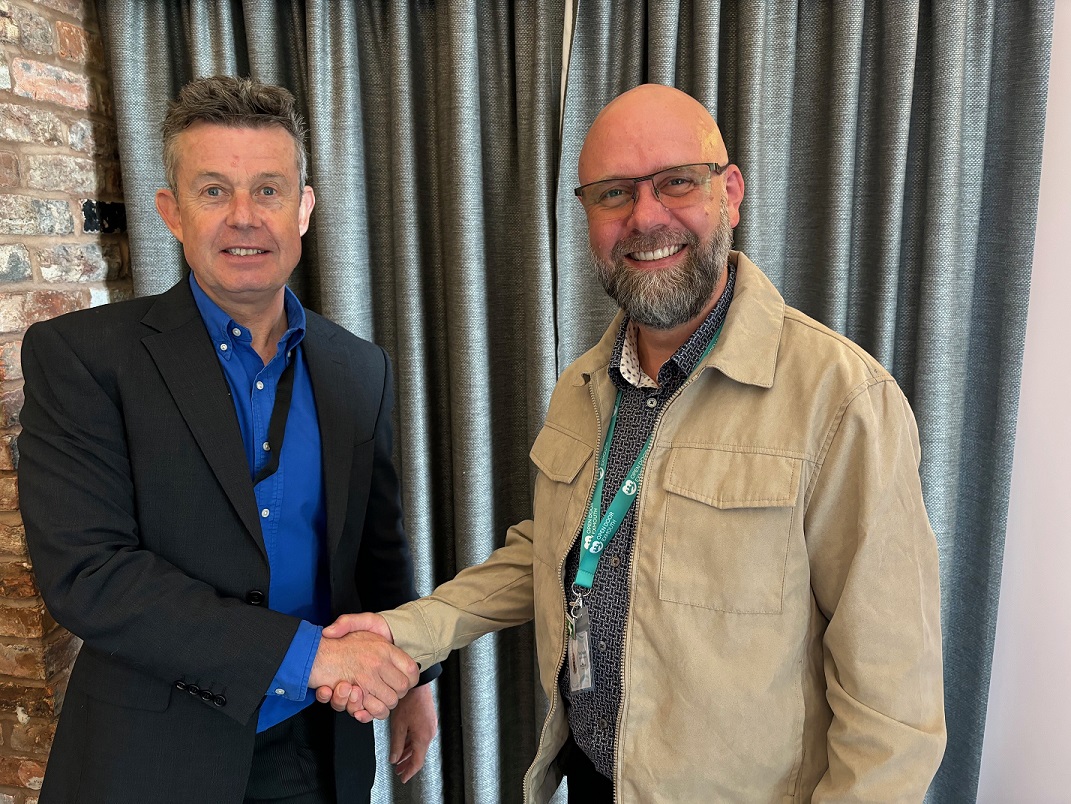 a couple of men shaking hands