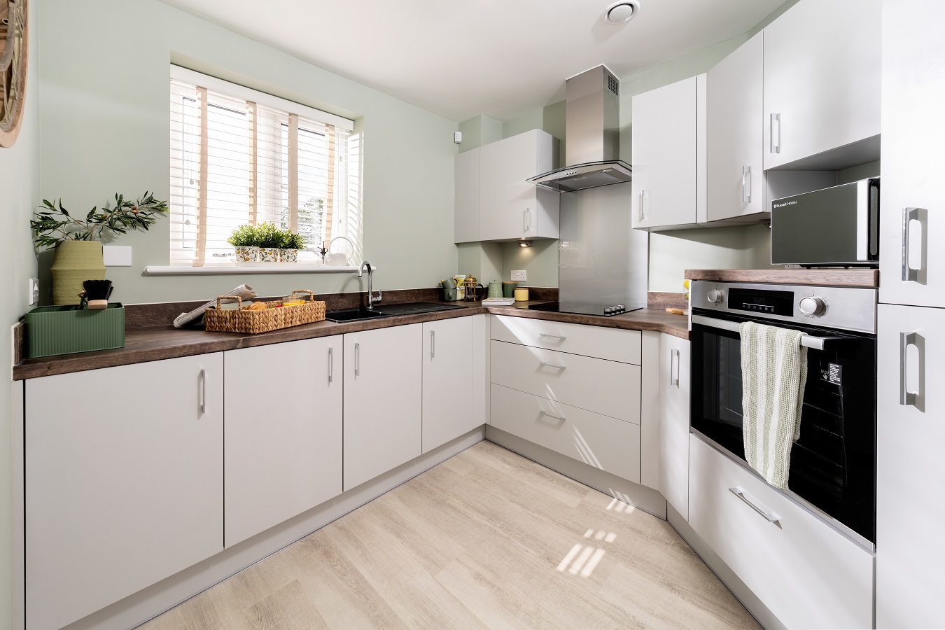 a kitchen with white cabinets