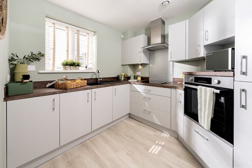 a kitchen with white cabinets