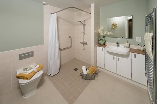 a bathroom with a shower and sink