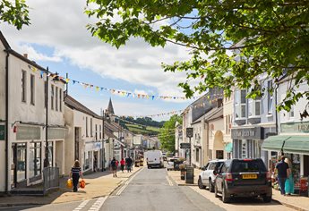 a street with cars and people on it