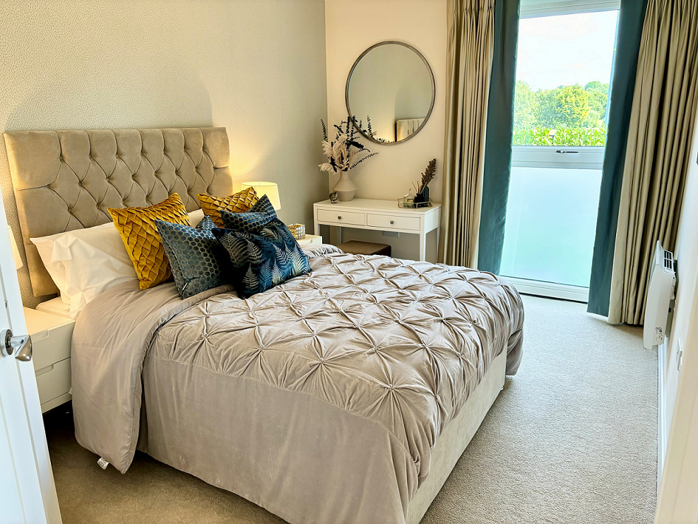 a bedroom with a large mirror