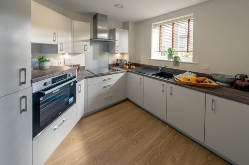 a kitchen with white cabinets