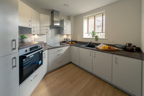 a kitchen with white cabinets