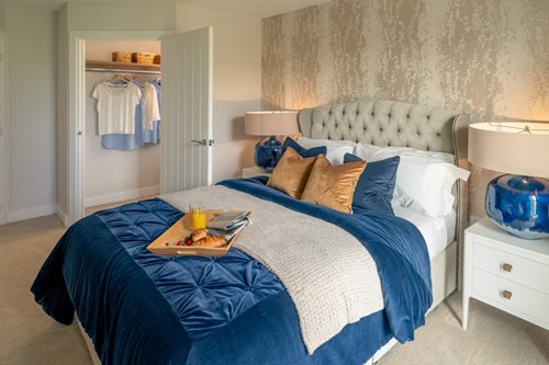 a bed with a blue blanket