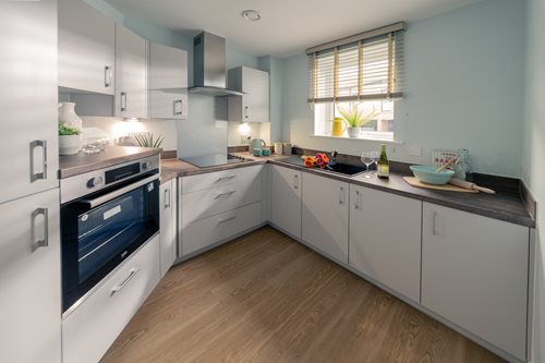 a kitchen with white cabinets
