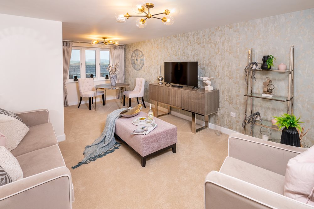 a living room with a tv and couches