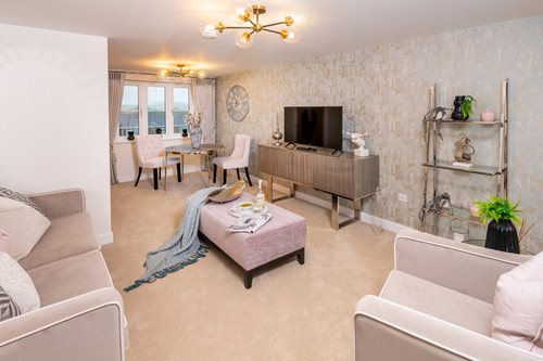 a living room with a tv and couches
