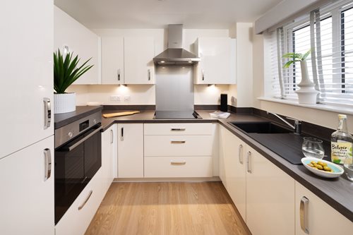 a kitchen with white cabinets