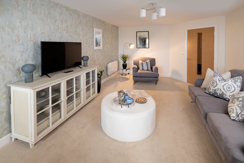a living room with a white table and a white coffee table