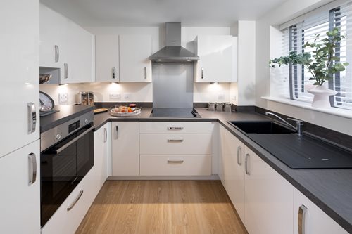a kitchen with white cabinets