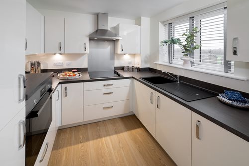 a kitchen with white cabinets