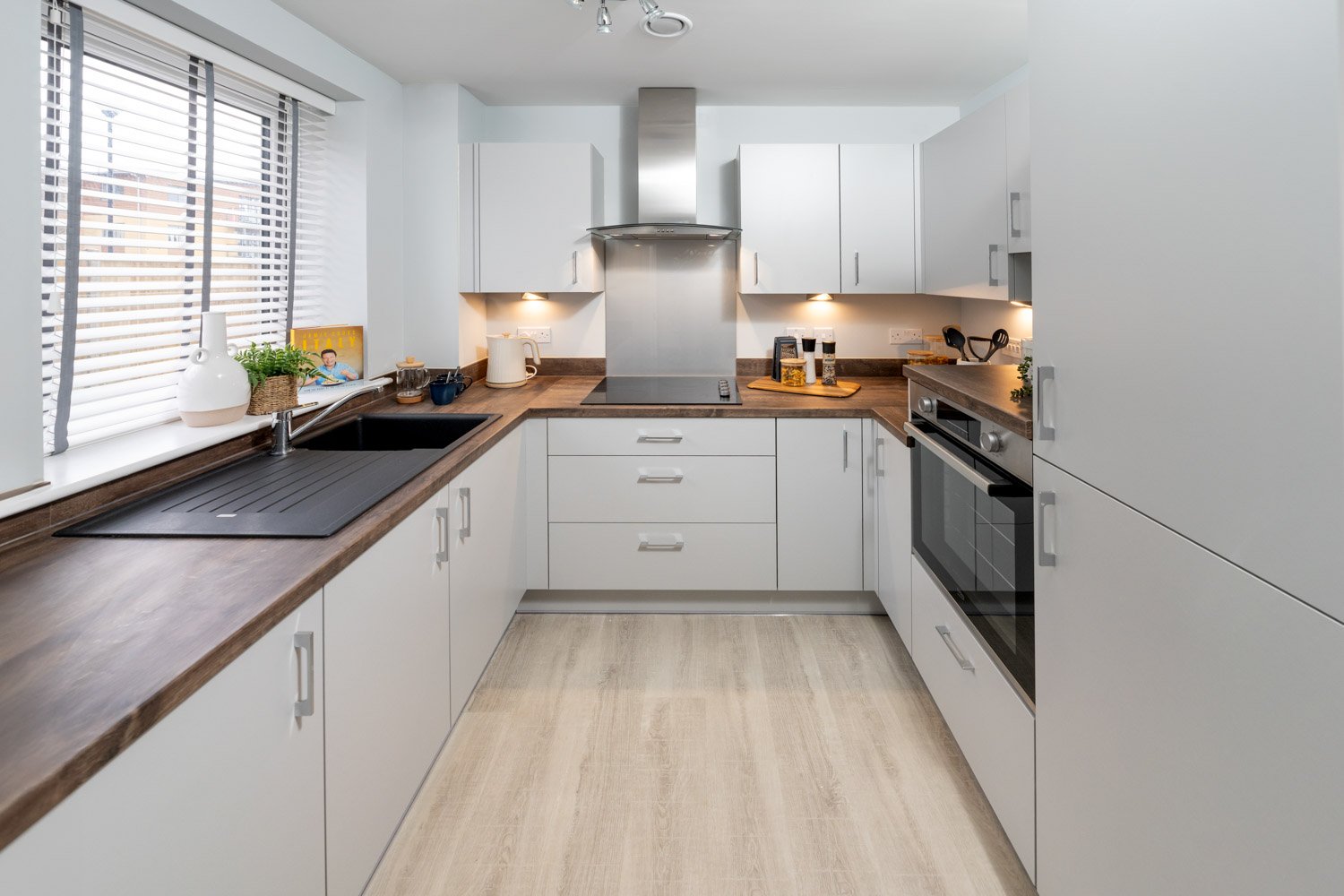 a kitchen with white cabinets