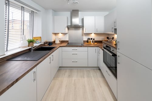 a kitchen with white cabinets