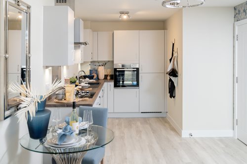 a kitchen with white cabinets