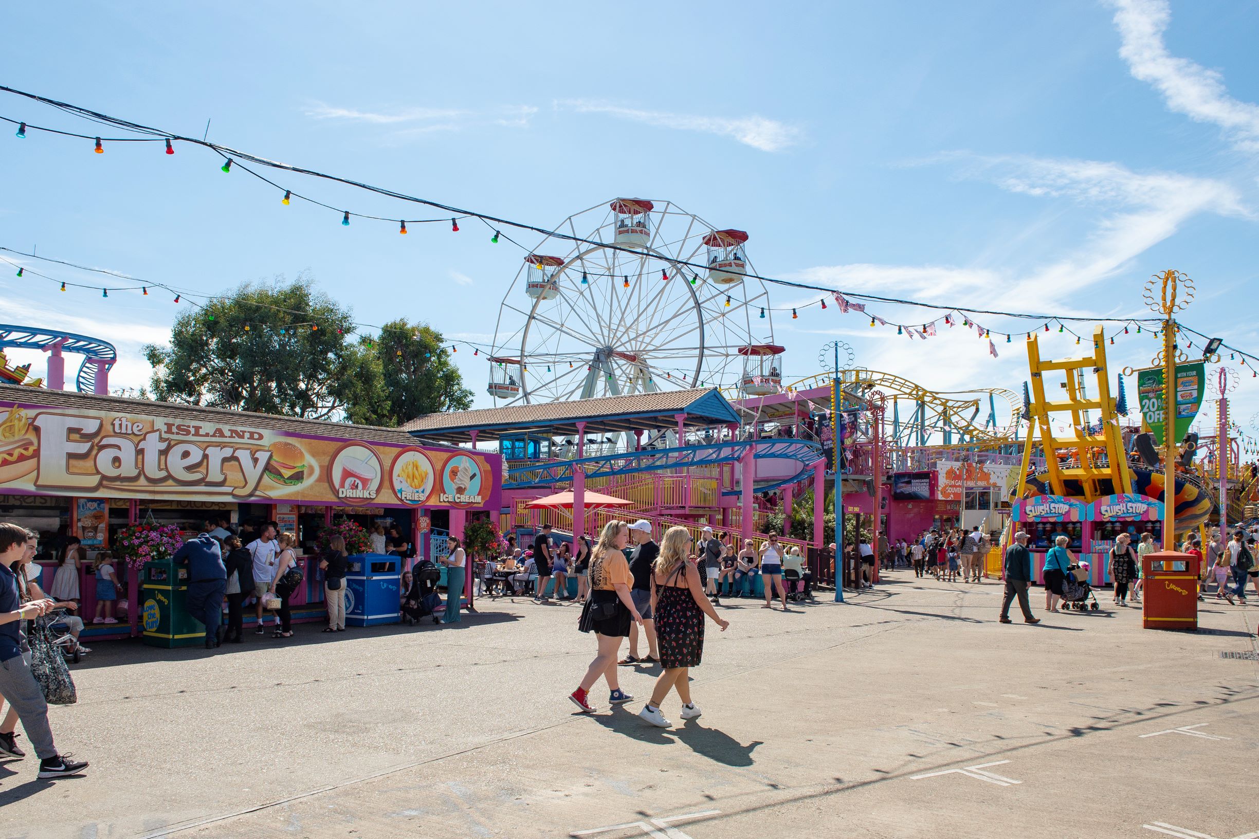 people walking near a carnival