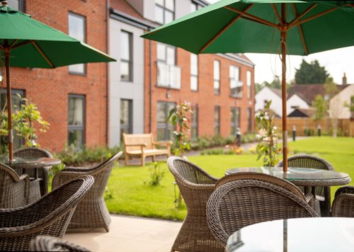 a patio with tables and chairs