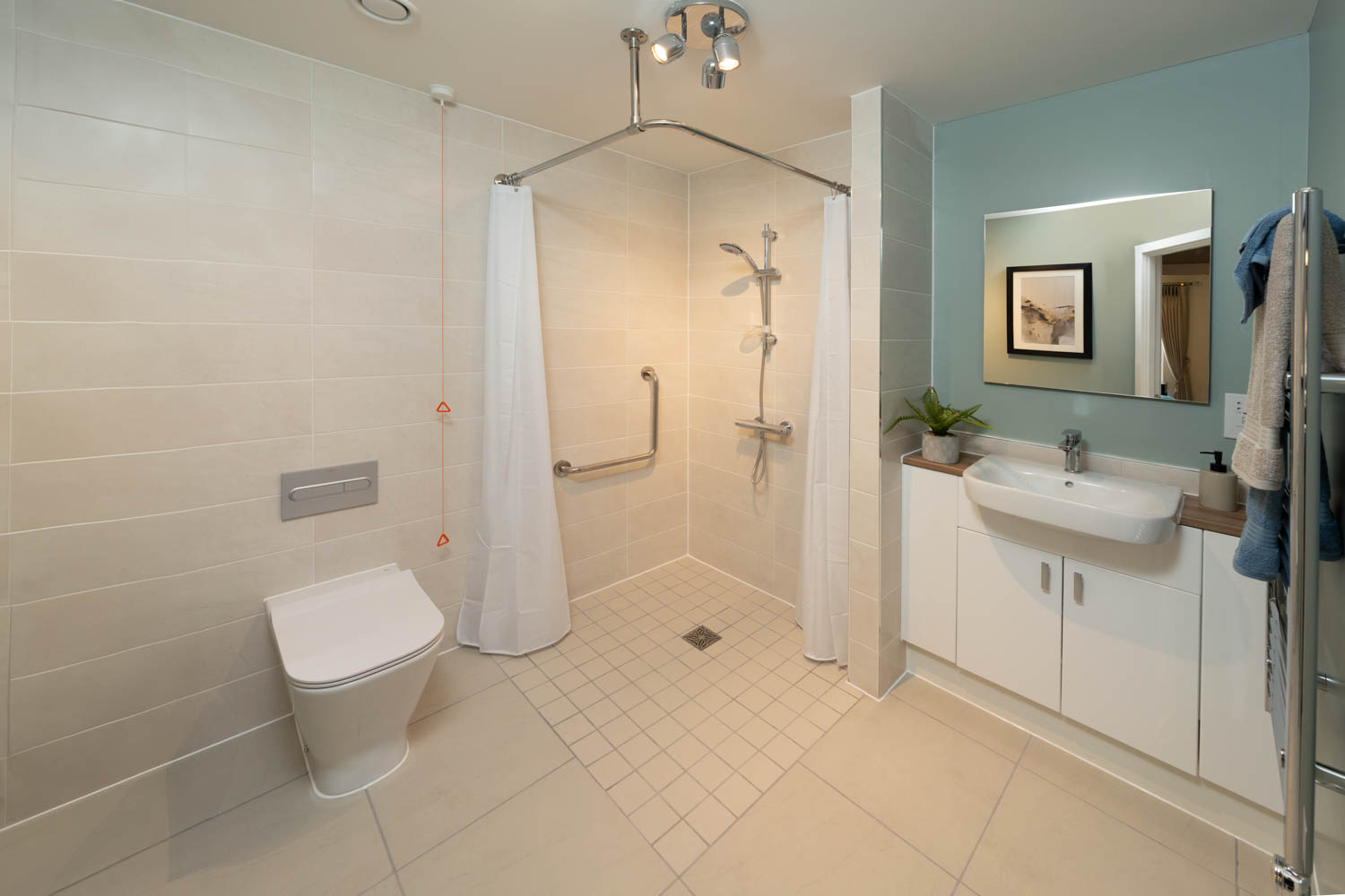 a bathroom with a shower and toilet