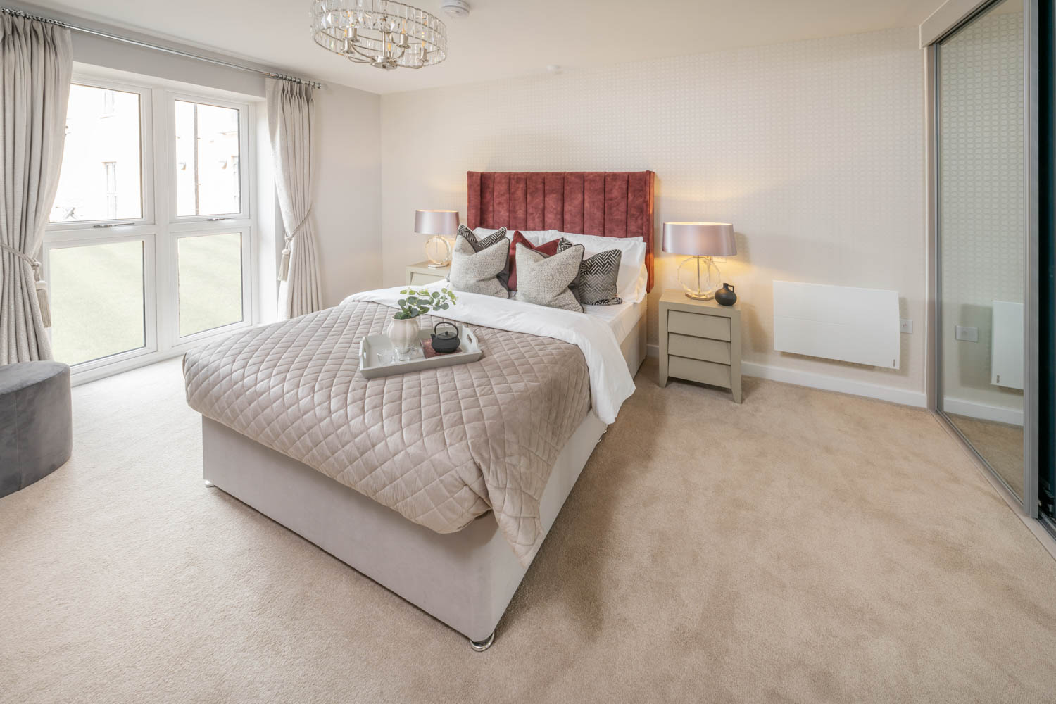 a bedroom with a bed and a table