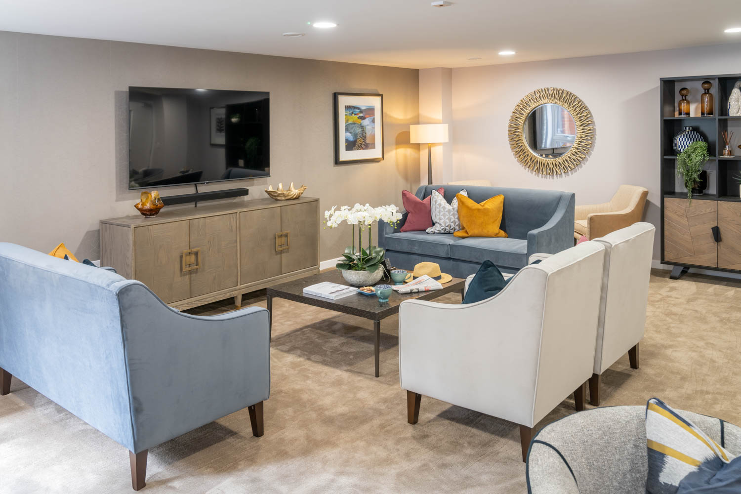 a living room with a tv and couches