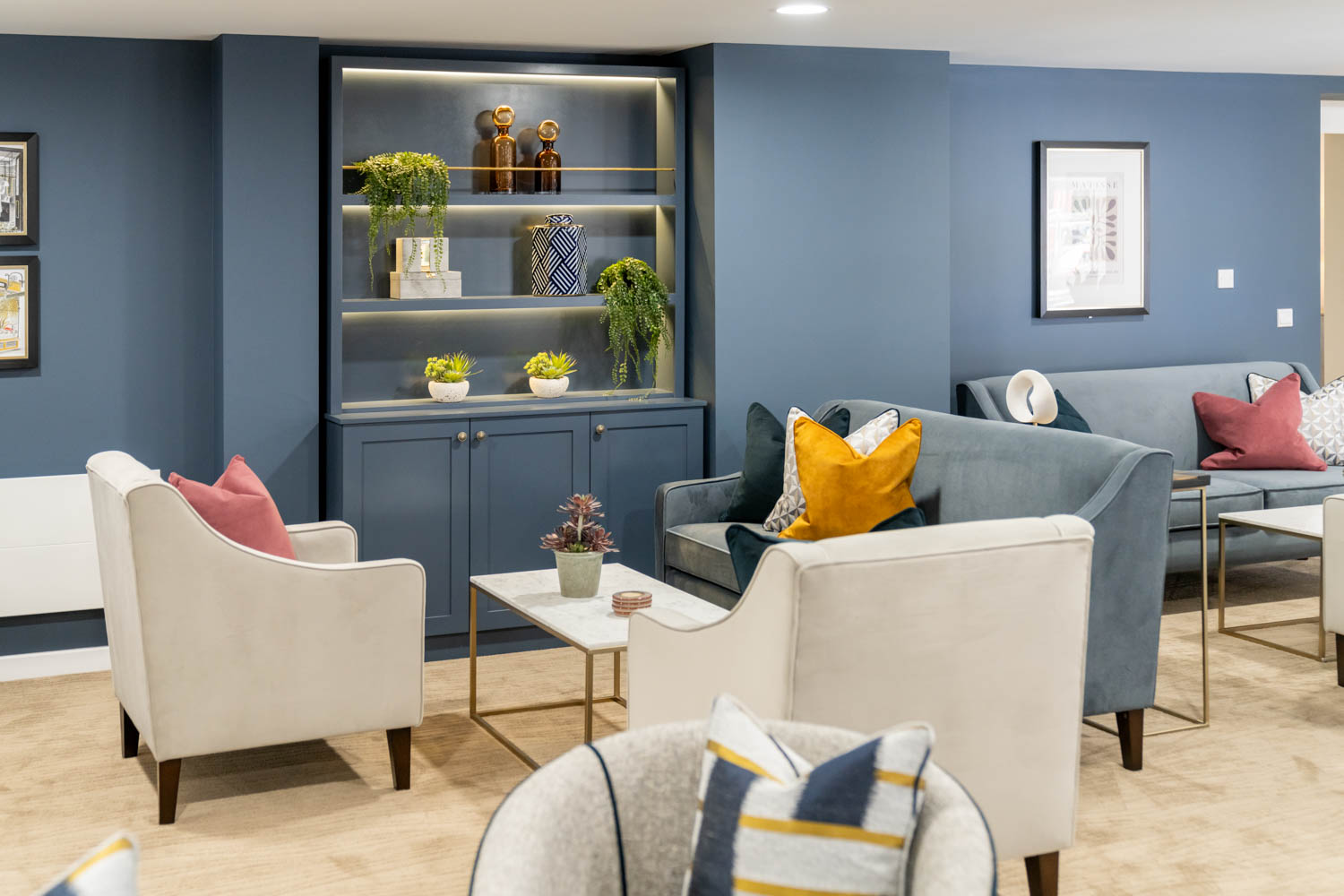 a living room with a blue wall