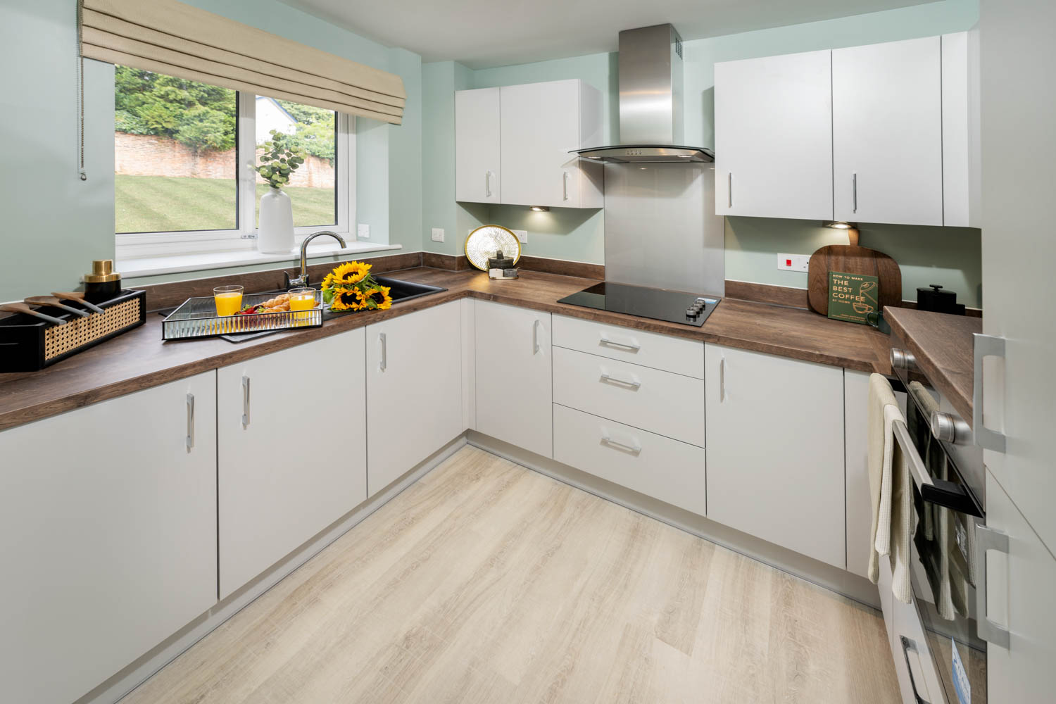 a kitchen with white cabinets