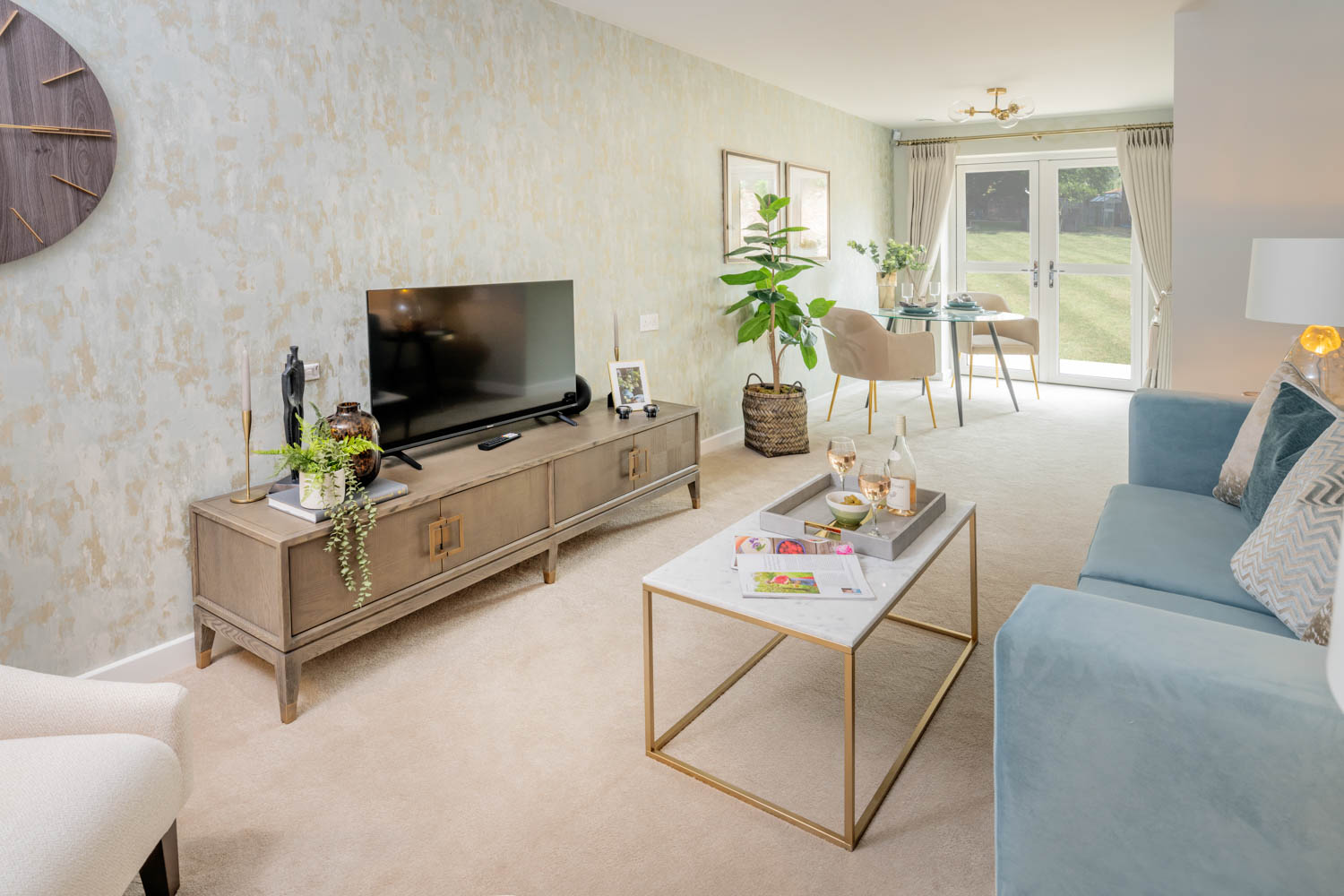 a living room with a tv and couches