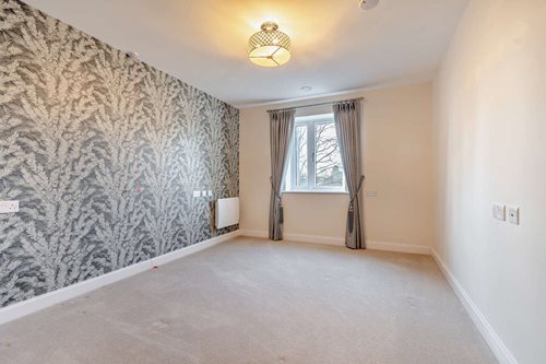 a room with a window and curtains